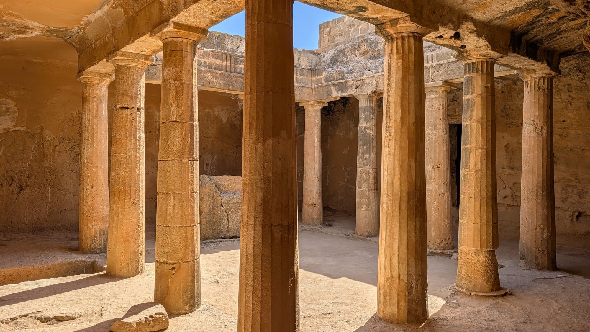 The rock-cut peristyle courtyard of the Tombs of the Kings, Kato Paphos.